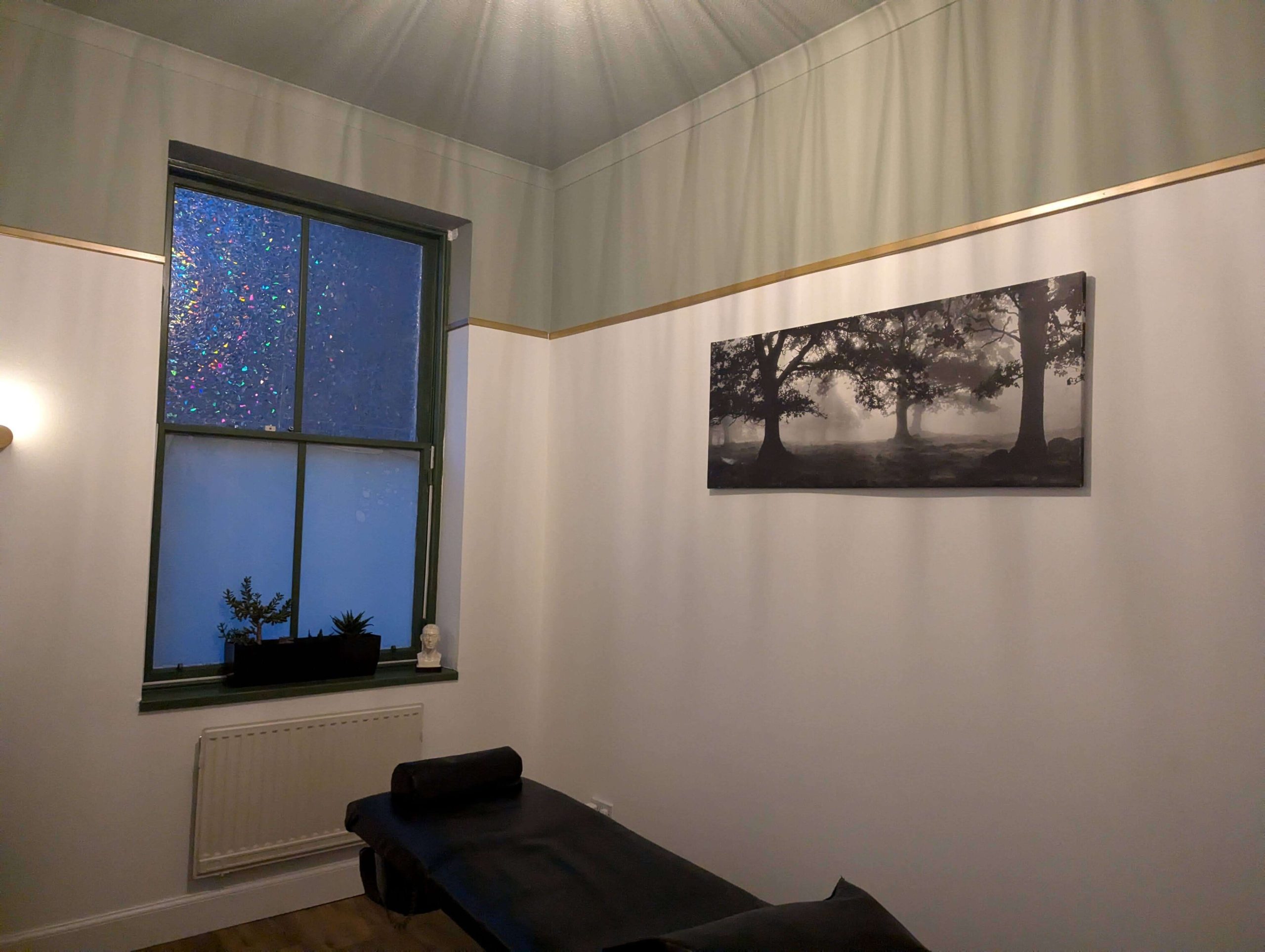 Paula's green and white clinic room in Glasgow